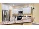 Kitchen with granite countertops and stainless steel appliances at 3060 Rambler Ave, Saint Cloud, FL 34772