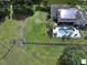 House with pool and solar panels, next to fenced pasture at 3060 Rambler Ave, Saint Cloud, FL 34772