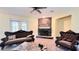 Spacious living room with stone fireplace and hardwood floors at 3060 Rambler Ave, Saint Cloud, FL 34772