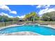 Inviting kidney-shaped pool with a stone deck, overlooking a fenced-in pasture at 3060 Rambler Ave, Saint Cloud, FL 34772