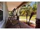 Relaxing porch swing overlooking the backyard at 3060 Rambler Ave, Saint Cloud, FL 34772