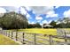 Open pasture with barns and lush greenery at 3060 Rambler Ave, Saint Cloud, FL 34772
