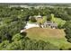 Aerial view of a house, barn, and expansive green space at 3060 Rambler Ave, Saint Cloud, FL 34772