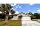 Attached garage with solar panels and landscaping at 3060 Rambler Ave, Saint Cloud, FL 34772