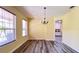 Bright dining room with hardwood floors and chandelier at 3060 Rambler Ave, Saint Cloud, FL 34772