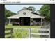 Large barn with multiple stalls and tack room at 3060 Rambler Ave, Saint Cloud, FL 34772