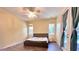 Spacious bedroom with ceiling fan and backyard access at 3060 Rambler Ave, Saint Cloud, FL 34772
