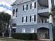 Three-story building with light blue exterior at 3561 Conroy Rd # 227, Orlando, FL 32839