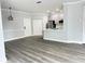 Open concept living and kitchen area with gray flooring at 3561 Conroy Rd # 227, Orlando, FL 32839