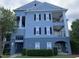 Three-story building with balconies and lush landscaping at 3561 Conroy Rd # 227, Orlando, FL 32839