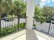 Private balcony overlooking the community parking lot at 3561 Conroy Rd # 227, Orlando, FL 32839