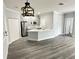 Open concept living and kitchen area with gray flooring at 3561 Conroy Rd # 227, Orlando, FL 32839