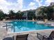 Resort-style pool with plenty of lounge chairs at 3561 Conroy Rd # 227, Orlando, FL 32839