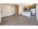 Open concept living area with modern kitchen, island, and staircase at 3229 Energy Dr, Kissimmee, FL 34747