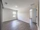 Bright bedroom with wood-look floors and large window at 3229 Energy Dr, Kissimmee, FL 34747