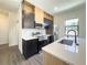 Modern kitchen with stainless steel appliances, wood cabinets, and quartz countertops at 3229 Energy Dr, Kissimmee, FL 34747