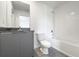 Clean bathroom with a tub, toilet and modern vanity at 3229 Energy Dr, Kissimmee, FL 34747