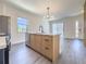 Modern kitchen with island and stainless steel appliances at 3229 Energy Dr, Kissimmee, FL 34747