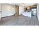 Open living area with kitchen and modern staircase at 3229 Energy Dr, Kissimmee, FL 34747