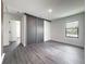 Bright bedroom with gray closet doors and window at 3229 Energy Dr, Kissimmee, FL 34747