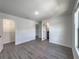 Spacious bedroom with wood flooring and access to bath at 3229 Energy Dr, Kissimmee, FL 34747