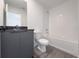 Clean bathroom with gray vanity and bathtub at 3229 Energy Dr, Kissimmee, FL 34747