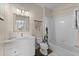 Clean bathroom with a tub, vanity, and updated fixtures at 8100 Princess Palm Ln # 201, Kissimmee, FL 34747