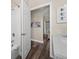 View into bathroom from hallway, showing vanity and toilet at 8100 Princess Palm Ln # 201, Kissimmee, FL 34747