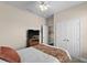 Bedroom with a queen bed, ceiling fan, double doors and a window at 8100 Princess Palm Ln # 201, Kissimmee, FL 34747