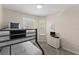 Charming bedroom with a bunk bed, TV, and dresser at 8100 Princess Palm Ln # 201, Kissimmee, FL 34747