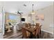 Living room with dining area and access to balcony at 8100 Princess Palm Ln # 201, Kissimmee, FL 34747