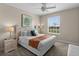 King-size bed, neutral decor, and a view of the backyard from the window at 8100 Princess Palm Ln # 201, Kissimmee, FL 34747