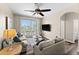 Spacious living area featuring comfortable seating and a view of the balcony at 8100 Princess Palm Ln # 201, Kissimmee, FL 34747