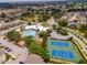 Community overview showing pool, tennis courts, and surrounding buildings at 8100 Princess Palm Ln # 201, Kissimmee, FL 34747