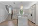 Modern kitchen with white cabinets, marble island, and stainless steel appliances at 2234 Via Luna, Winter Park, FL 32789