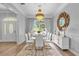 Elegant dining room with chandelier and modern white chairs at 2234 Via Luna, Winter Park, FL 32789