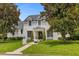 Two story house with white brick exterior, manicured lawn, and walkway at 2234 Via Luna, Winter Park, FL 32789