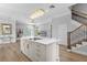 Island kitchen with marble countertops and breakfast bar at 2234 Via Luna, Winter Park, FL 32789