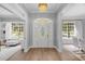 Bright entryway with hardwood floors, arched entry, and views into adjacent rooms at 2234 Via Luna, Winter Park, FL 32789
