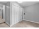 Simple bedroom with white closet doors and neutral walls at 2234 Via Luna, Winter Park, FL 32789