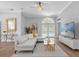 Spacious living area featuring a comfortable sectional sofa and pool access at 2234 Via Luna, Winter Park, FL 32789