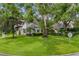Charming curb appeal with mature trees and well-manicured lawn at 2234 Via Luna, Winter Park, FL 32789