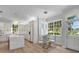 Eat-in kitchen with white cabinets, island, and view to backyard at 2234 Via Luna, Winter Park, FL 32789
