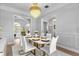 Bright dining room featuring a white table and gold accents at 2234 Via Luna, Winter Park, FL 32789