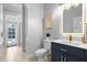 Powder room with modern vanity and gold accents at 2234 Via Luna, Winter Park, FL 32789