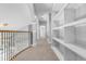 Upper hallway with built-in shelving and neutral carpeting at 2234 Via Luna, Winter Park, FL 32789