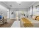Luxurious main bedroom with a large bed, gold accents, and ensuite access at 2234 Via Luna, Winter Park, FL 32789