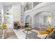 Spacious living room with high ceilings, a fireplace, and built-in shelving at 2234 Via Luna, Winter Park, FL 32789