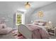 Charming bedroom with a pink comforter and white framed bed at 2234 Via Luna, Winter Park, FL 32789