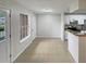 Kitchen and dining area with tile flooring at 5545 Devonbriar Way # I101, Orlando, FL 32822